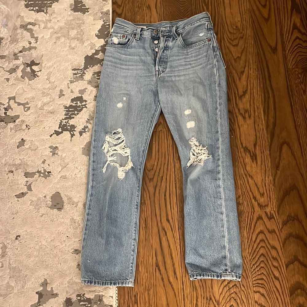 Levi’s with ripped knees